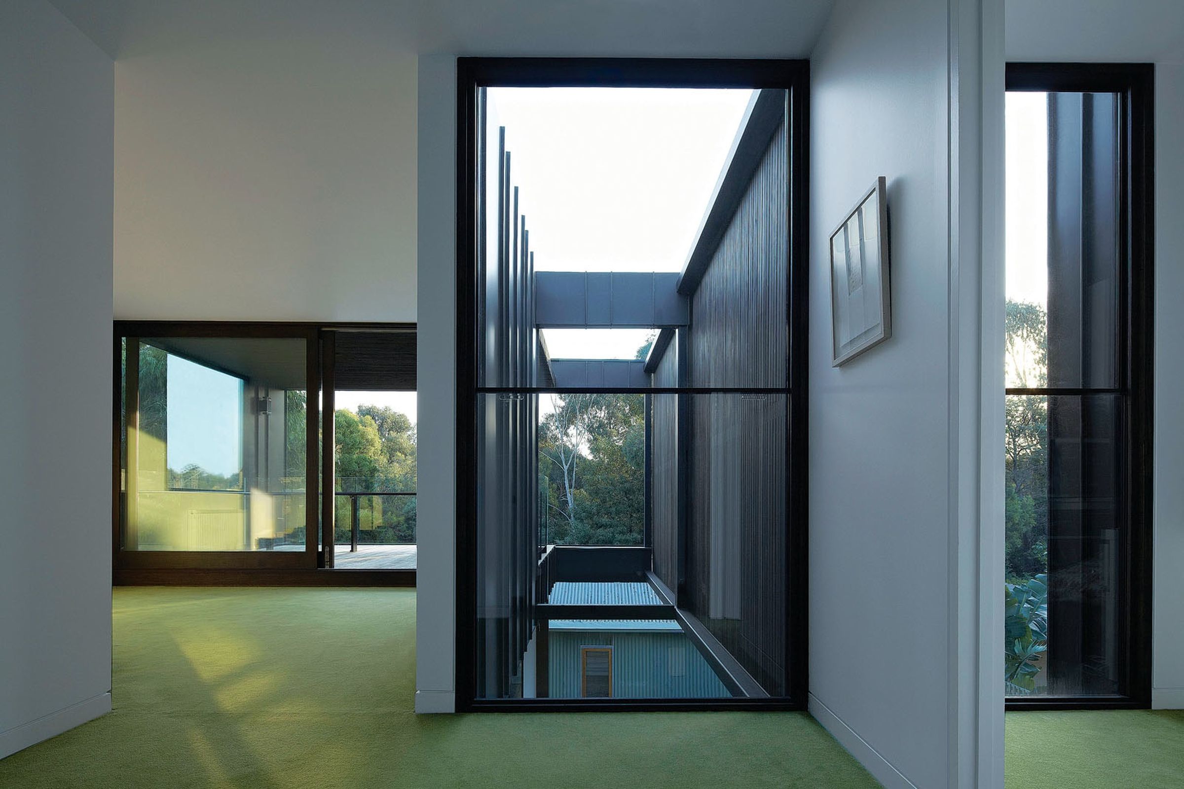 House by the Park upper interior with large framed windows and carpet