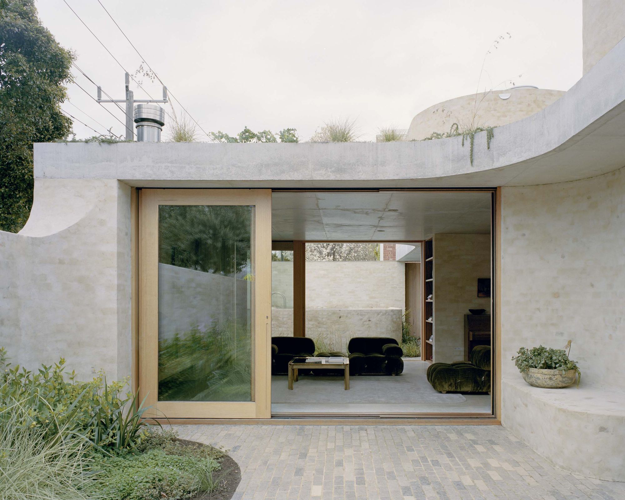 Mary Street House courtyard with timber sliding doors and living area beyond